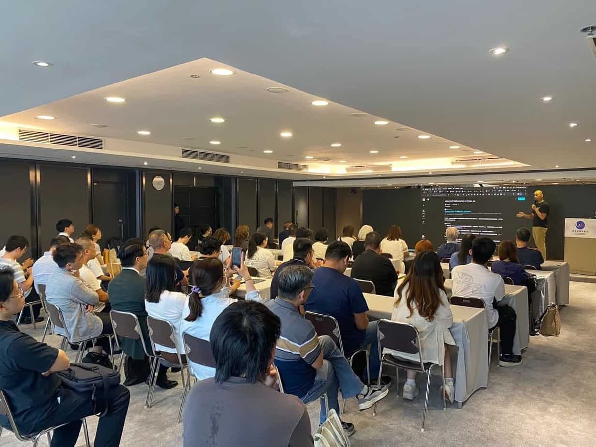 Ivan So presenting AI automation strategy at industry seminar in Hong Kong